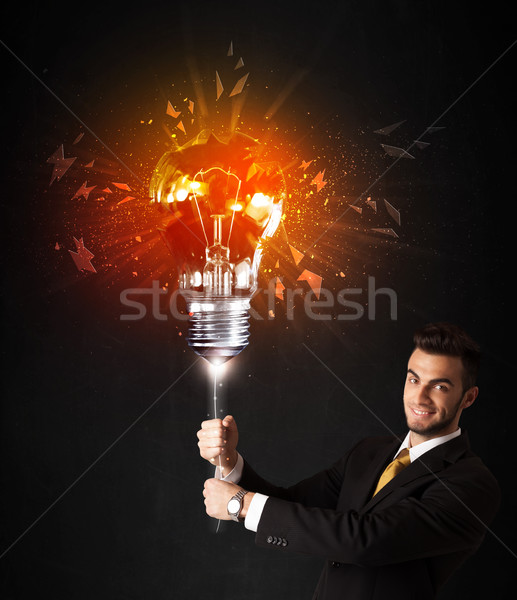 Stockfoto: Zakenman · explosie · lamp · zwarte · glimlach · lamp