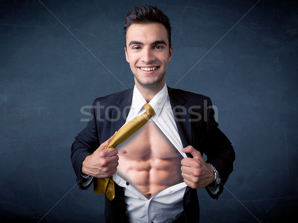 Businessman tearing off shirt and showing mucular body Stock photo © ra2studio