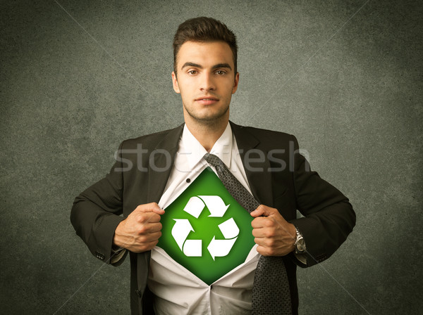 Enviromentalist business man tearing off shirt with recycle sign Stock photo © ra2studio