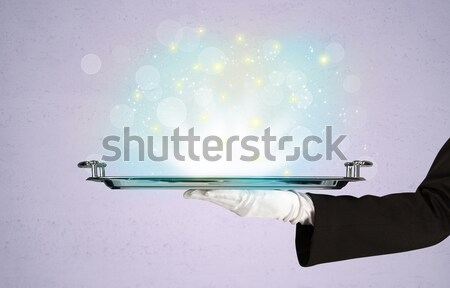 Bright lights presented on tray by waiter Stock photo © ra2studio