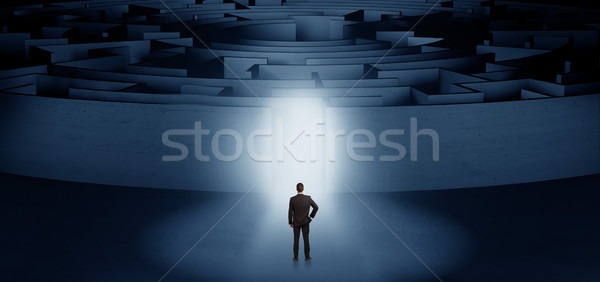 Businessman starting a concentric labyrinth Stock photo © ra2studio