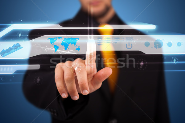 Stock photo: Businessman pressing high tech type of modern buttons