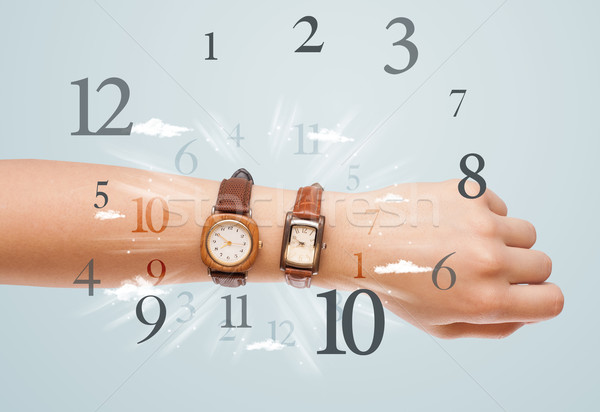 Hand with watch and numbers on the side comming out Stock photo © ra2studio