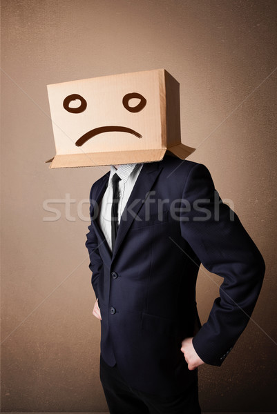 Businessman gesturing with cardboard box on his head with sad fa Stock photo © ra2studio