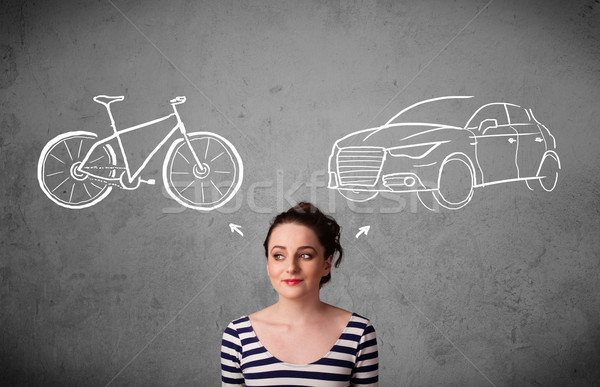 Stock photo: Woman making a choice between bicycle and car