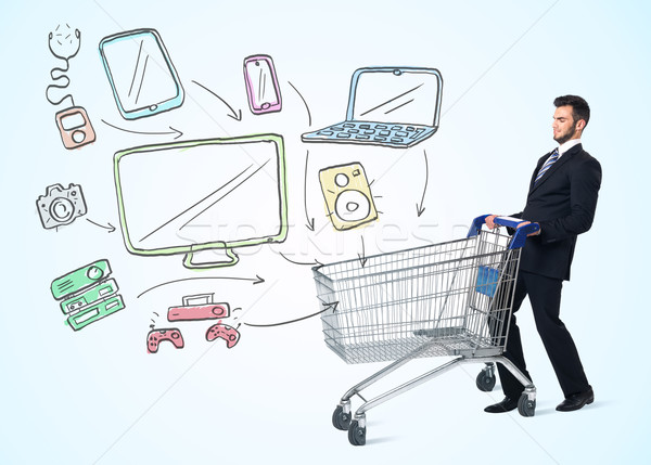 Businessman with shopping cart Stock photo © ra2studio