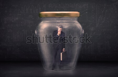 Business man closed into a glass jar concept Stock photo © ra2studio