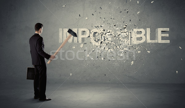 Homme d'affaires impossible signe marteau mur [[stock_photo]] © ra2studio