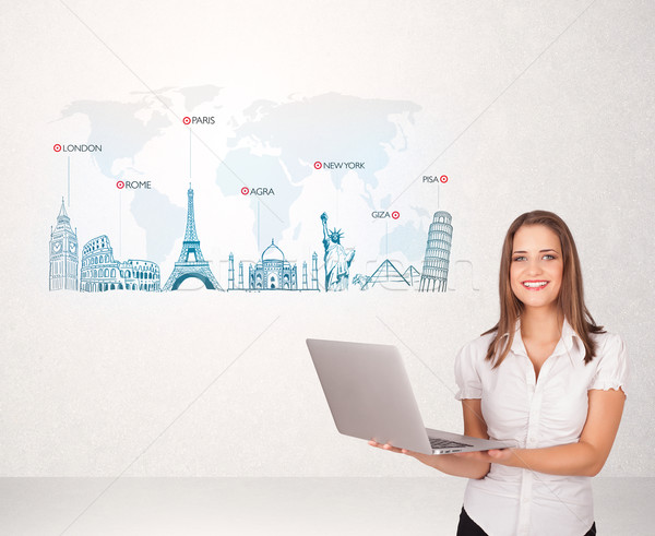 Business woman presenting map with famous cities and landmarks Stock photo © ra2studio