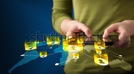 Hand holding tablet device with social network map Stock photo © ra2studio