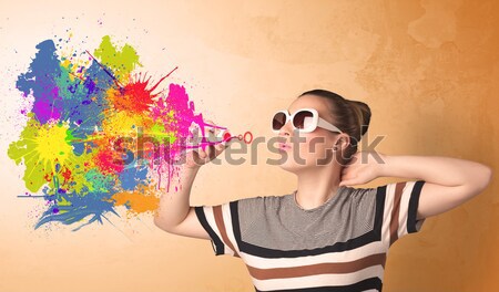 Cute girl blowing colorful splash graffiti  Stock photo © ra2studio