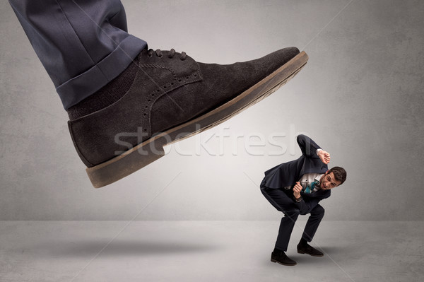 Small man trampled by the great power Stock photo © ra2studio
