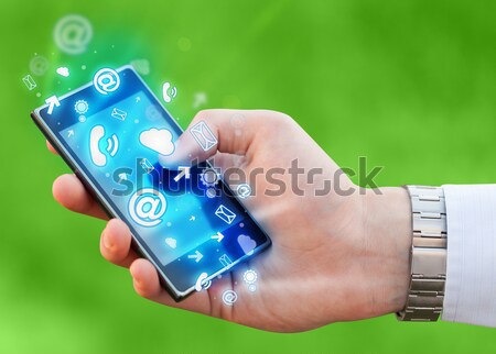 Hand with smartwatch and call icon around Stock photo © ra2studio