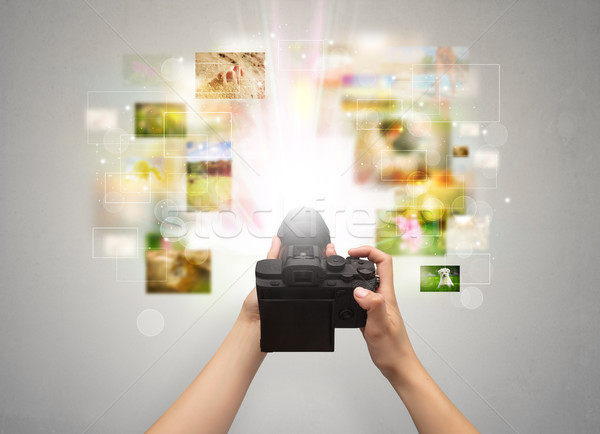 Hand captures life events with digital camera Stock photo © ra2studio