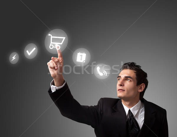  man pressing a touchscreen button Stock photo © ra2studio