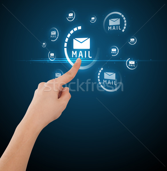 Businessman pressing virtual messaging type of icons Stock photo © ra2studio