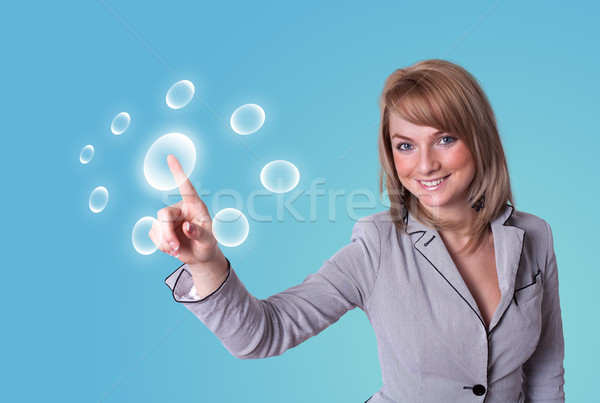 woman pressing digital buttons Stock photo © ra2studio