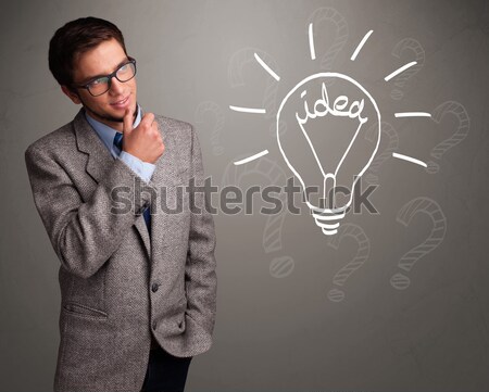 Young boy comming up with a light bulb idea sign Stock photo © ra2studio