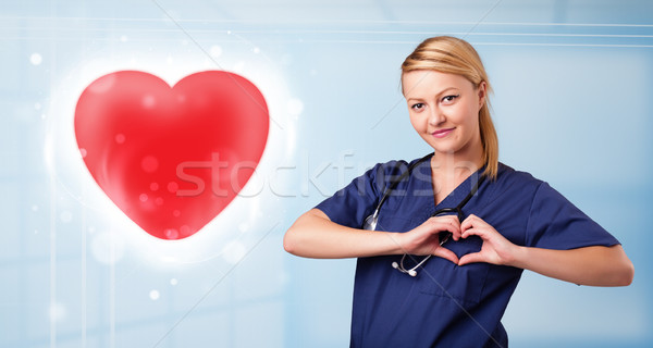 Zdjęcia stock: Młodych · pielęgniarki · uzdrowienie · czerwony · serca · dość