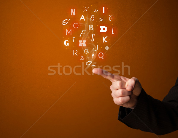 Letters coming out of gun shaped hands Stock photo © ra2studio