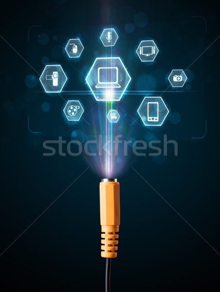 Electric cable with multimedia icons Stock photo © ra2studio