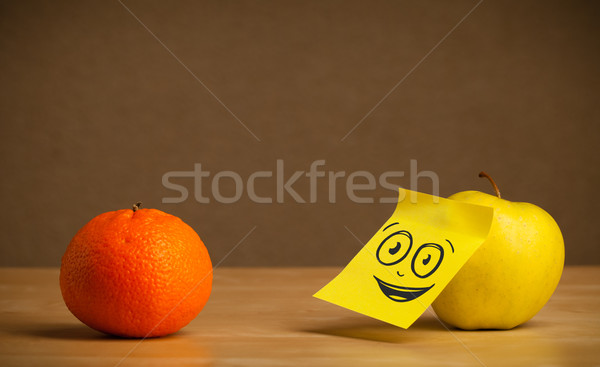 Stock photo: Apple with post-it note watching at orange