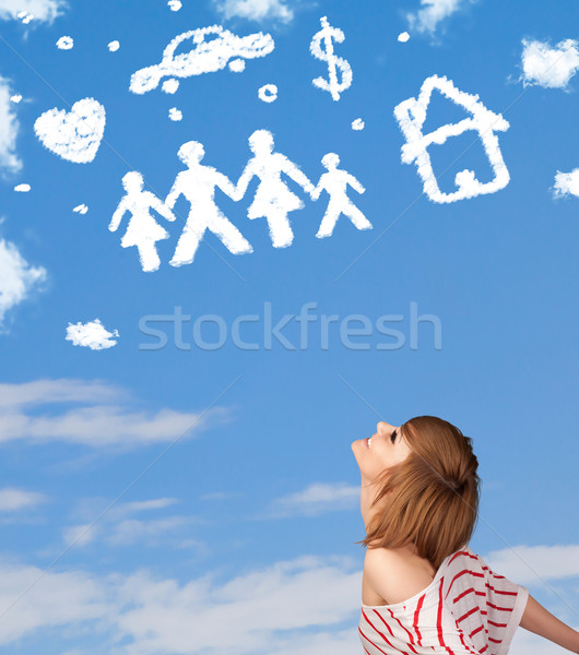 Young girl daydreaming with family and household clouds  Stock photo © ra2studio