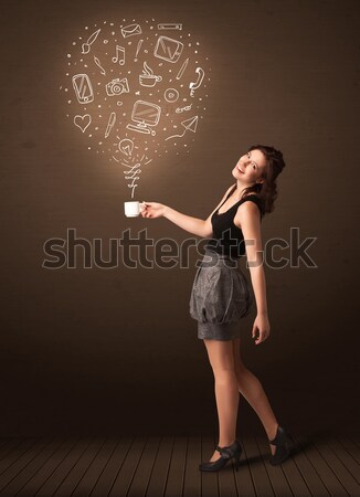 Businesswoman holding a white cup with social media icons Stock photo © ra2studio