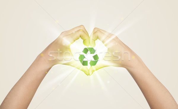 Hands creating a form with recycling sign Stock photo © ra2studio