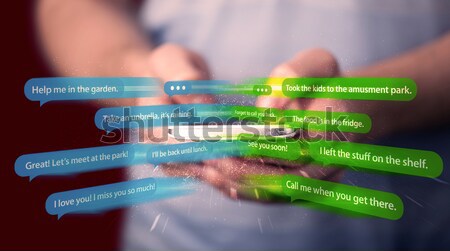 Jeune femme écrit messages smartphone demande téléphone [[stock_photo]] © ra2studio