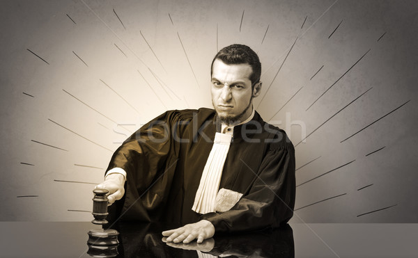 Oldscool young judge in gown deciding Stock photo © ra2studio