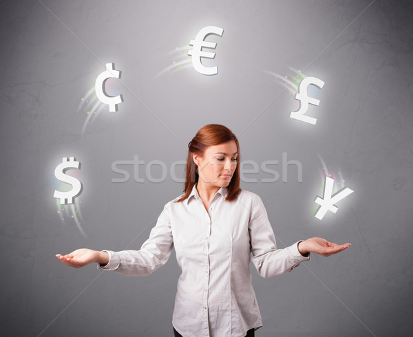  young lady standing and juggling with currency icons Stock photo © ra2studio