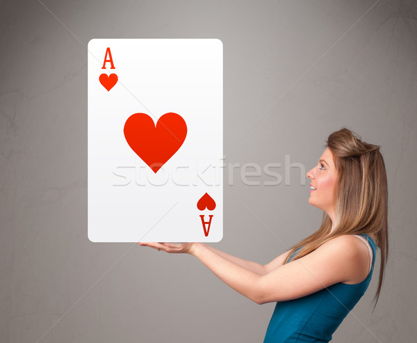 Beautifu woman holding a red heart ace Stock photo © ra2studio