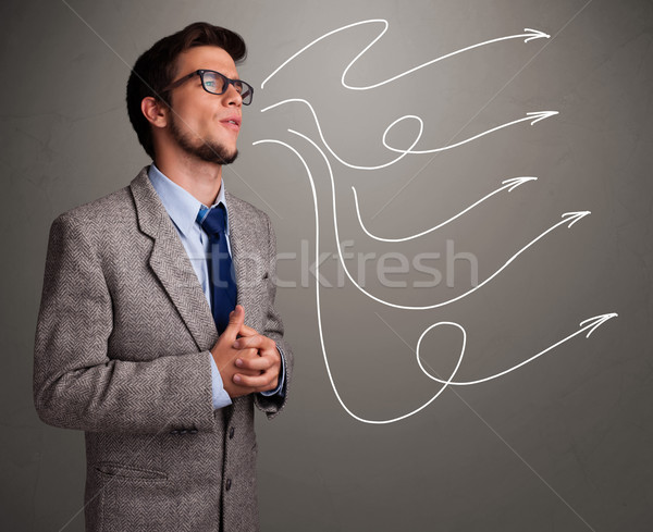 Attractive man looking at multiple curly arrows Stock photo © ra2studio