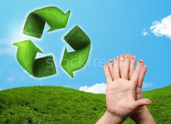 Happy smiley fingers looking at green leaf recycle sign Stock photo © ra2studio