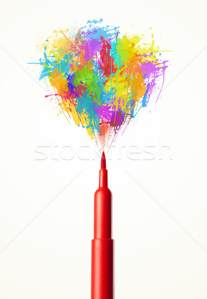 Stock photo: Felt pen close-up with colored paint splashes