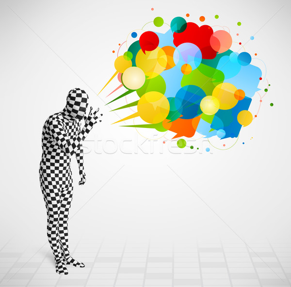 Strange guy in morphsuit looking at colorful speech bubbles Stock photo © ra2studio