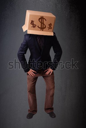 Young man gesturing with a cardboard box on his head with dollar Stock photo © ra2studio
