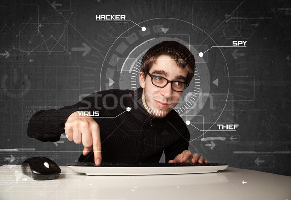 Young hacker in futuristic enviroment hacking personal informati Stock photo © ra2studio