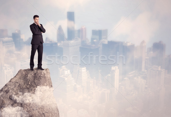 Winner urban businessman on top of stone  Stock photo © ra2studio