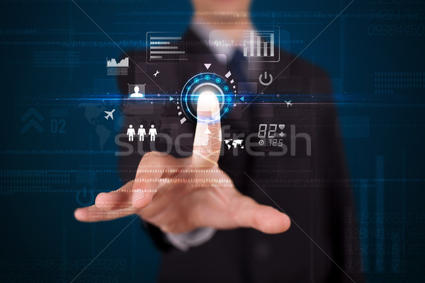 Stock photo: Handsome businessman touching future web technology buttons and 