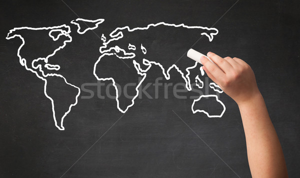 Adult drawing world map on chalkboard Stock photo © ra2studio