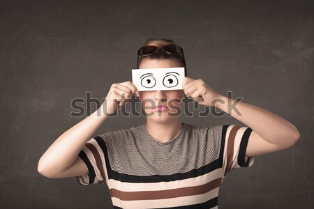 Funny woman looking with hand drawn paper eyes Stock photo © ra2studio