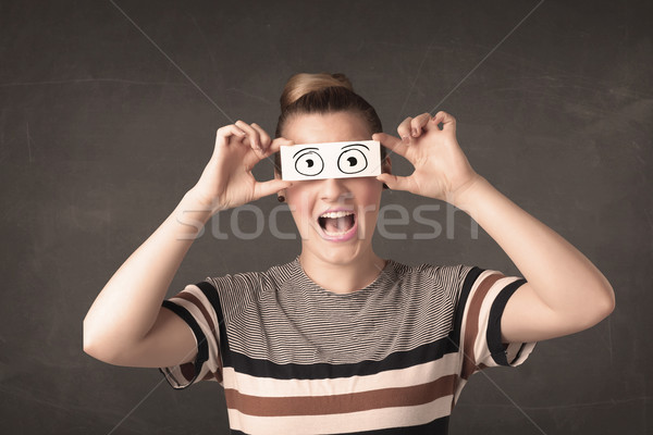 Funny woman looking with hand drawn paper eyes Stock photo © ra2studio