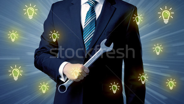 Leader standing with tools on his hand Stock photo © ra2studio