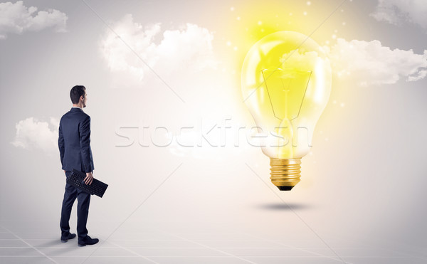 Férfi néz Föld földgömb szívesség üzletember Stock fotó © ra2studio