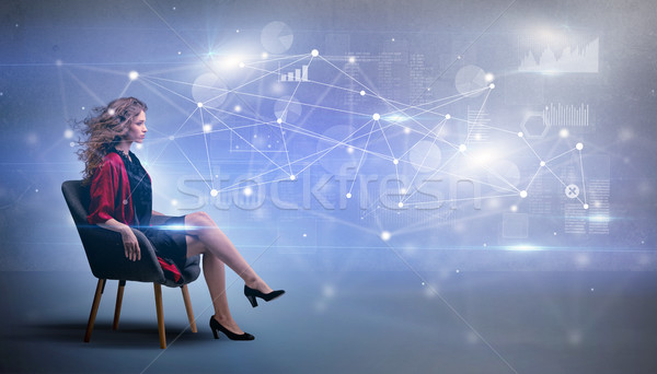 Kobieta posiedzenia sieci związku elegancki sofa Zdjęcia stock © ra2studio