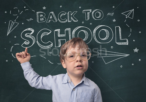 Cute boy with back to school concept Stock photo © ra2studio