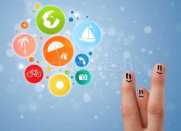 Cheerful happy smiling fingers with colorful holiday travel bubble icons Stock photo © ra2studio