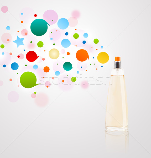 Perfume bottle spraying colored bubbles Stock photo © ra2studio